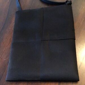 DKNY Fabric interlock fabric design, leather strap lined, zipper pocket bag